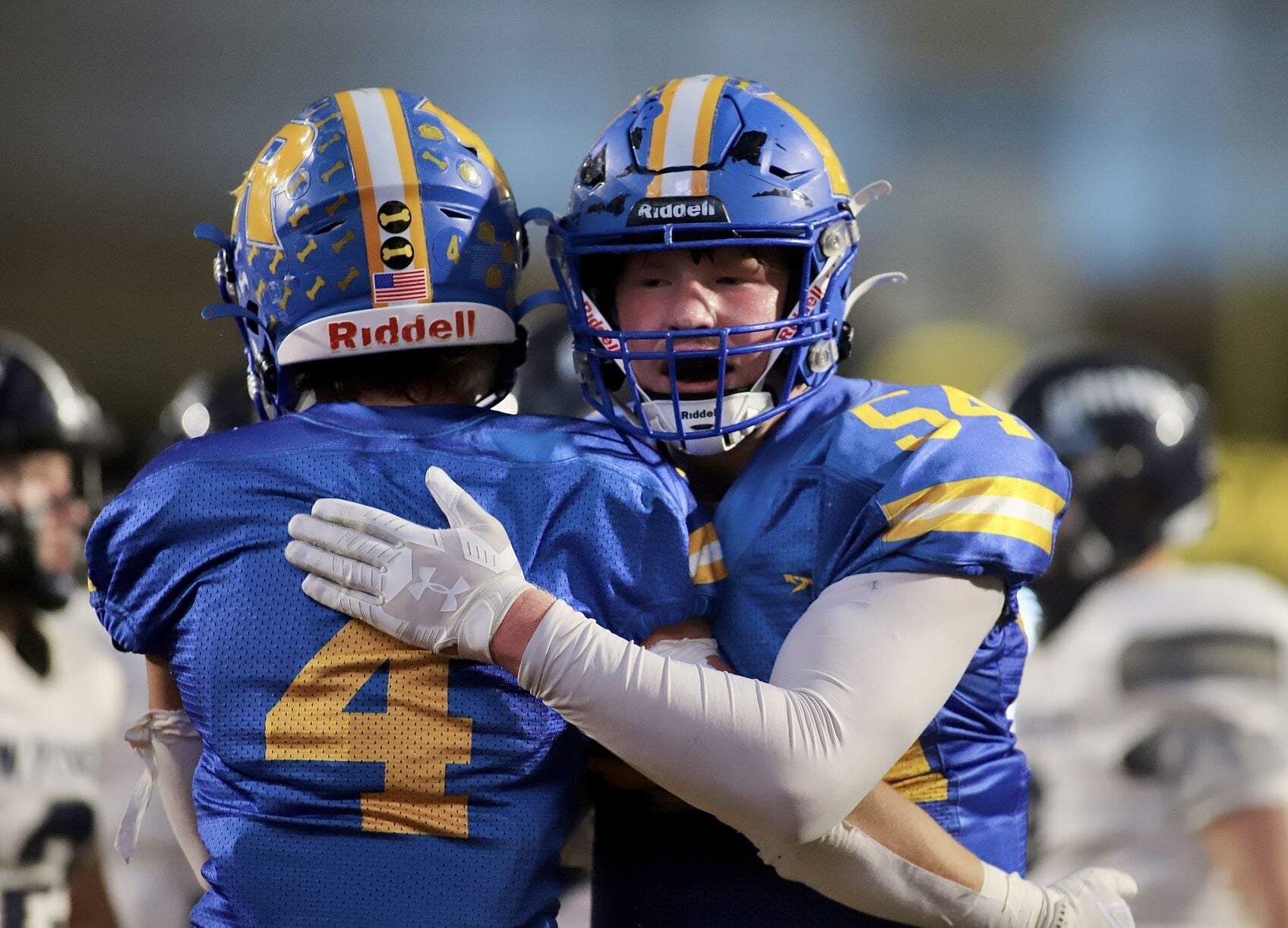 Bulldogs football team celebrating a road win